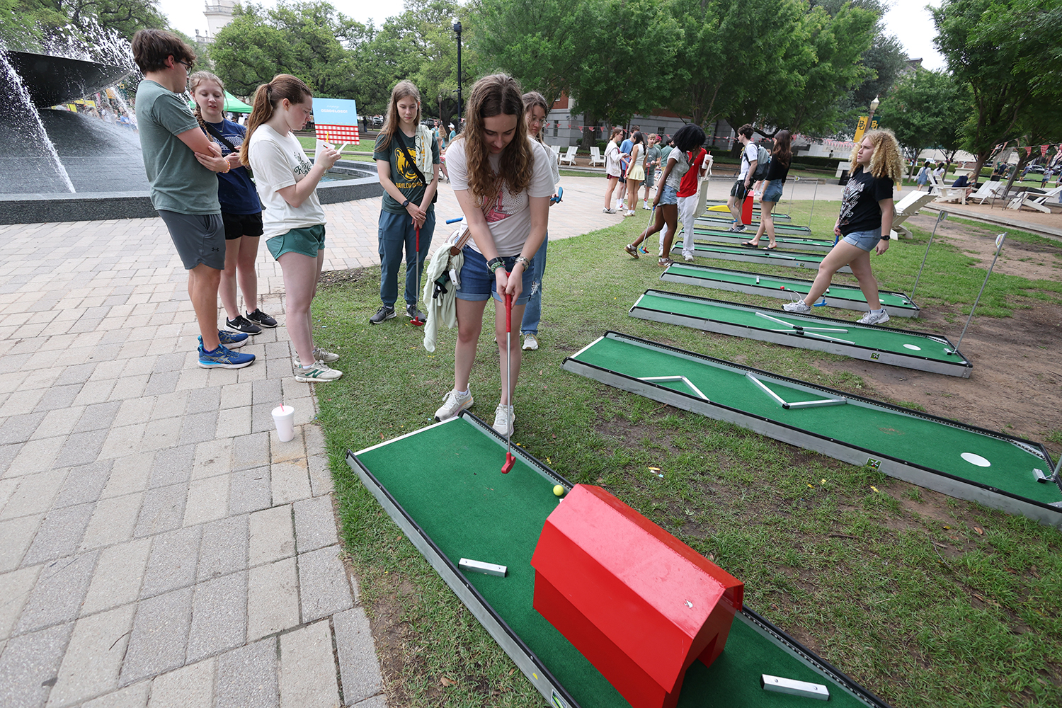 Baylor Student playing mini golf